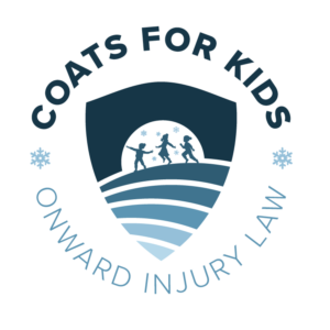 logo that has Coats for Kids at the top with a shield in the middle featuring children playing in the snow. Onward Injury Law is at the bottom